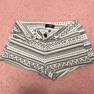 white and black tribal print shorts
